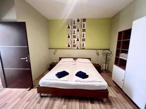 Postel nebo postele na pokoji v ubytování Aqua Apartmanok