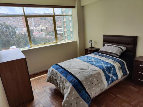 En eller flere senge i et værelse på Departamento céntrico