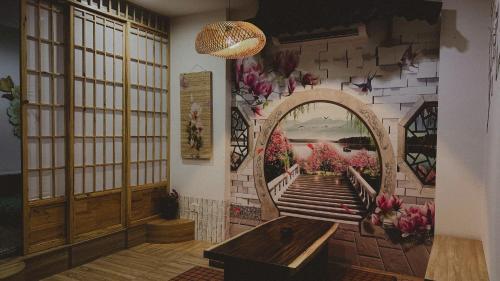 a room with a bench and a wall with a mirror at Milo's Home in Gò Công