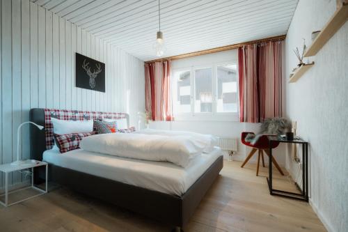 En eller flere senge i et værelse på Apartment Enzian