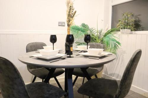 a table with two glasses of wine on it at The Hidden Gem in Longford