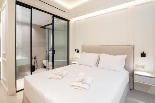 Postel nebo postele na pokoji v ubytování Kivos Luxury Apartments