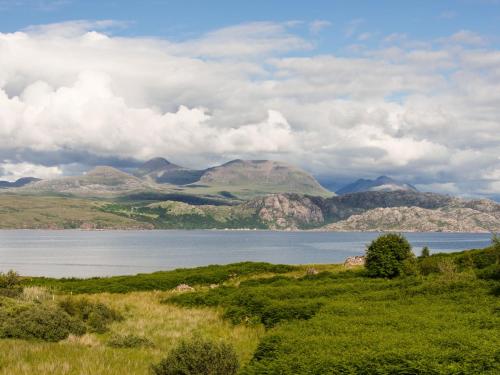 a view of a large body of water with mountains at Tigh An Iasgair in Fearnmore