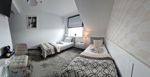 Postel nebo postele na pokoji v ubytování Cynamon