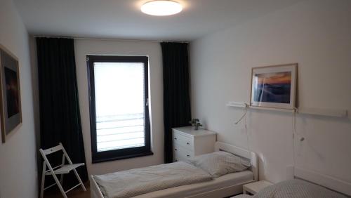 Ένα ή περισσότερα κρεβάτια σε δωμάτιο στο Apartments A + L