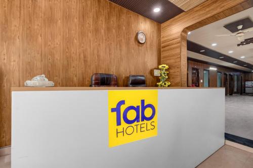 a sign for a toro hotels office in a lobby at FabHotel Vrishti Residency in Greater Noida