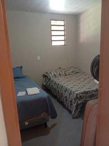 Postel nebo postele na pokoji v ubytování Espaço relax