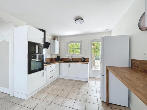 Kuchyň nebo kuchyňský kout v ubytování Cozy Alclau