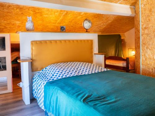 Ένα ή περισσότερα κρεβάτια σε δωμάτιο στο La Maison Ocre