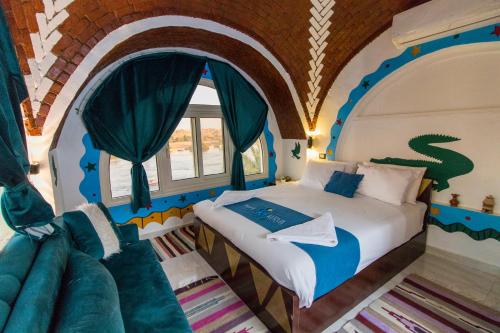 Ένα ή περισσότερα κρεβάτια σε δωμάτιο στο Casa Nile View rooms - Nubian House