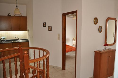 a kitchen with a stairway leading into a room at Villa Agalianos in Kerames