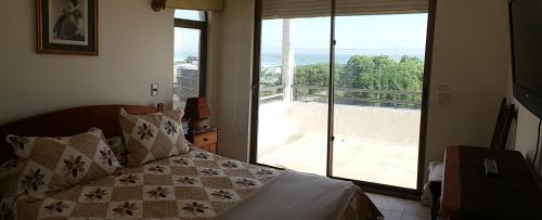 Кровать или кровати в номере Maitencillo Opas Apartment