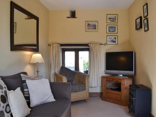 Et tv og/eller underholdning på Oak Barn Cottage