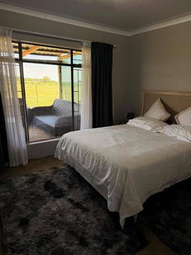 Ένα ή περισσότερα κρεβάτια σε δωμάτιο στο Gigi Lifestyle Cottage