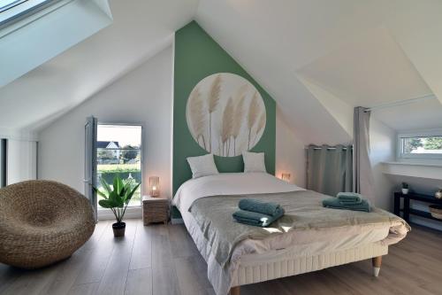 En eller flere senge i et værelse på Ty Kastine - Charmante maison pour 10