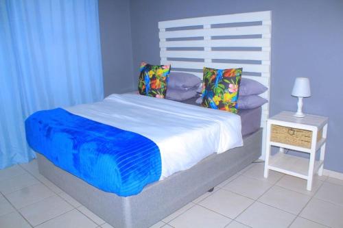 Ένα ή περισσότερα κρεβάτια σε δωμάτιο στο Zebra Family Unit