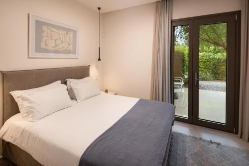 Postel nebo postele na pokoji v ubytování Stablo Residence