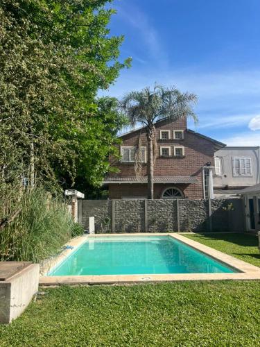 a swimming pool in the yard of a house at Casa Illia relax in Funes