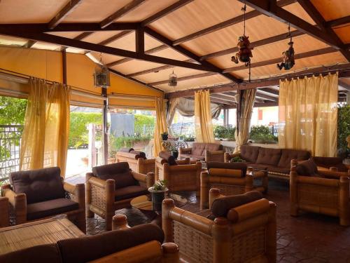 a large living room with couches and chairs at Sweet Dreams Residence in Brugine