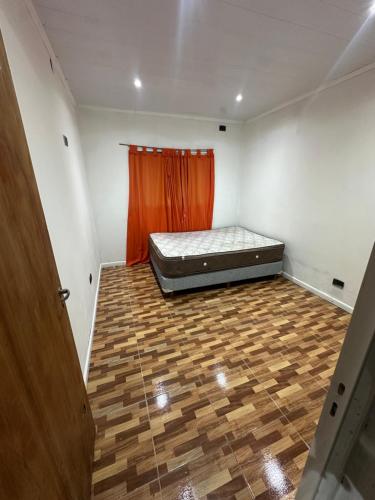 a room with a bed in the corner of a room at Quinta descansar in Concepción del Uruguay