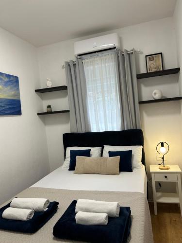 Ένα ή περισσότερα κρεβάτια σε δωμάτιο στο Apartment Tajra