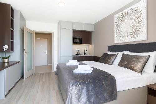 Ένα ή περισσότερα κρεβάτια σε δωμάτιο στο Hotel Awam