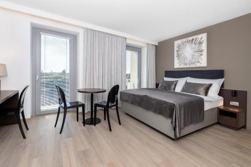 Ένα ή περισσότερα κρεβάτια σε δωμάτιο στο Hotel Awam