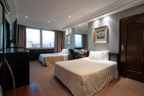 Postel nebo postele na pokoji v ubytování Plaza São Rafael Hotel