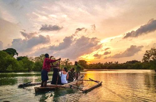 a group of people on a boat on a lake at Executive Tamarind Nest in Ukunda