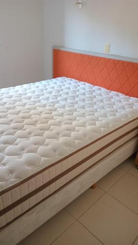 a mattress sitting on a bed in a room at Apartamento para Sammer Fest 2026 in Blumenau