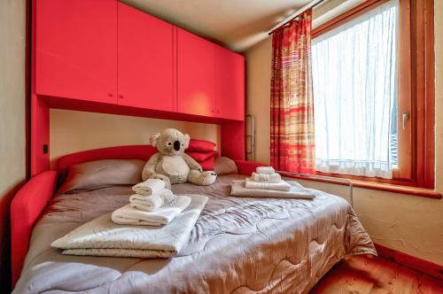 Postel nebo postele na pokoji v ubytování Genziana