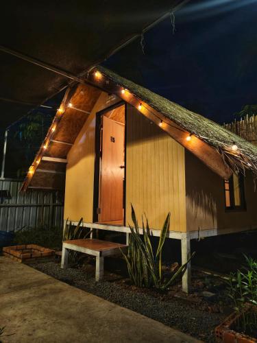 a small house with a bench and lights on it at Backpack Hostel Kohyaoyai in Ko Yao Yai