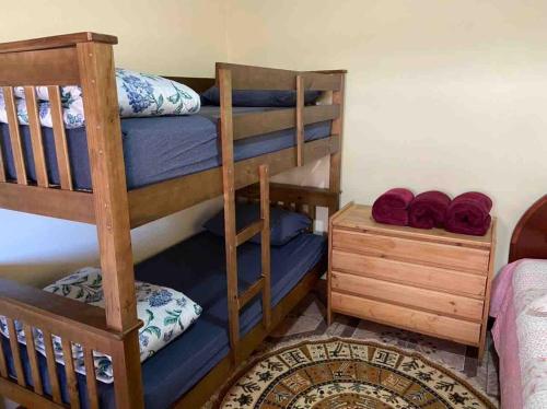 En eller flere senge i et værelse på Refúgio da Montanha