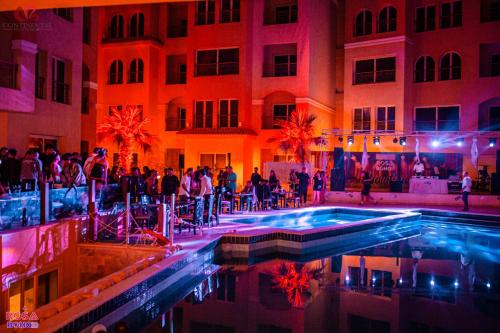 a group of people standing in front of a building at Rosa Boho Hotel And Aqua Park in Hurghada