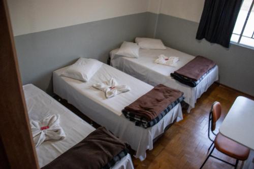 Postel nebo postele na pokoji v ubytování Novo Hotel