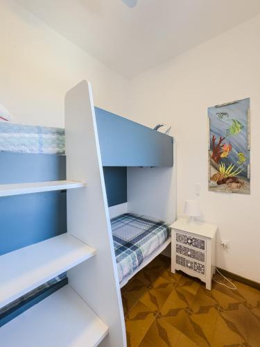 a small room with a bunk bed and a desk at casale nonna Elisa relax tra ulivi in San Vito Chietino