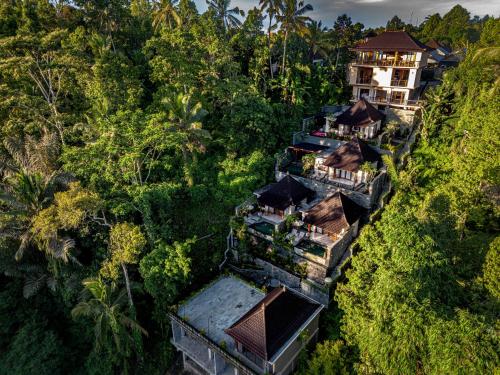 an aerial view of a resort in the jungle at Ellena Resort Tegallalang by Dhananjaya Hospitality in Tampaksiring