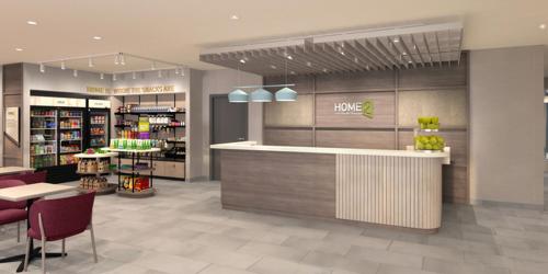 a store with a counter and chairs in a store at Home2 Suites By Hilton Salisbury Fruitland in Fruitland