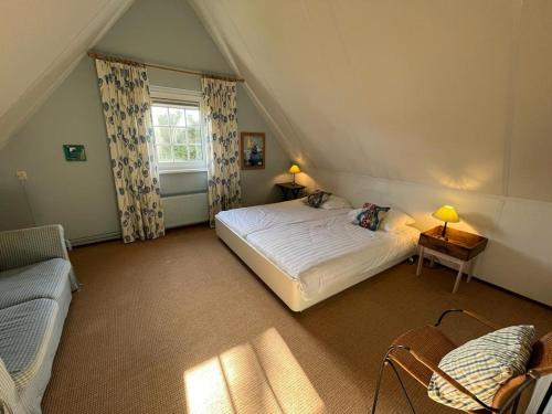 Ένα ή περισσότερα κρεβάτια σε δωμάτιο στο Vakantiewoning Westhoek