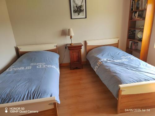 En eller flere senge i et værelse på Gîte familial avec salle de jeux