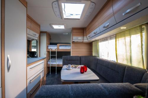 Posezení v ubytování Kleines Mobilheim mit toller Ausstattung und Vorzelt im Heide Resort Brüggen