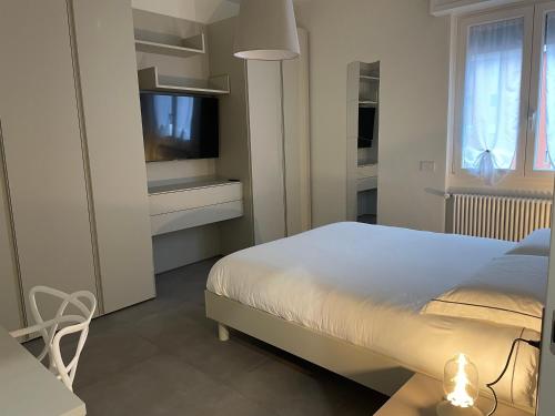 Ένα ή περισσότερα κρεβάτια σε δωμάτιο στο Domus Pyrus Apartments