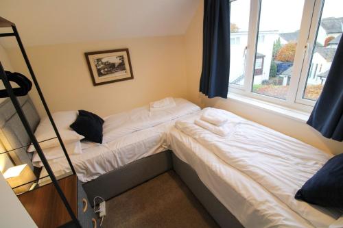 Voodi või voodid majutusasutuse Molly's Mews, lake view, Bowness on Windermere toas