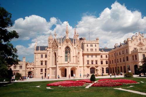 a large building with flowers in front of it at U Ladi in Bulhary