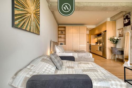 En eller flere senge i et værelse på Stunning 1 BR Condo - Alameda Central - Downtown