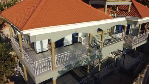 an aerial view of a house with an orange roof at McMillan Hotel in Entebbe