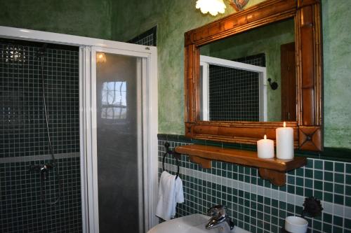 a bathroom with a sink and a mirror at Finca Higueron with private Pool in Río