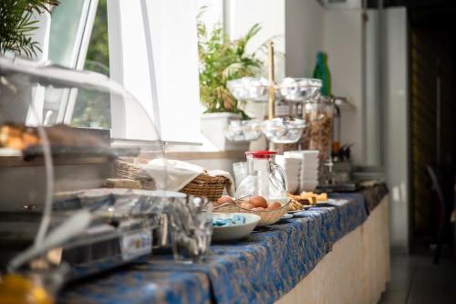 a counter top with baskets of food on it at Hotiday Conegliano in Conegliano