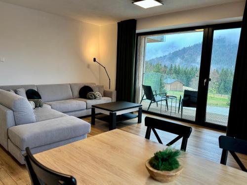 Posezení v ubytování WOODLAND apartment and sauna