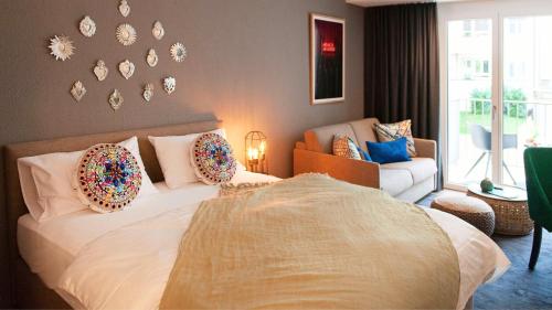 a bedroom with a bed with donuts on it at COSMOPOLITAN APARTMENTS Zürich Seefeld in Zürich